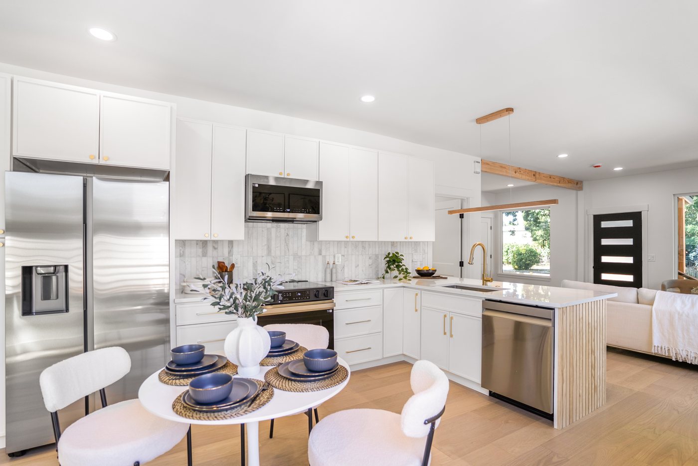 Remodeled white kitchen with a round dining table, Ellis Ave, Seattle
